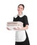 Young chambermaid holding stack of towels on white background