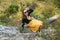 Young charm woman on a stone enjoying in landscape