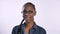 Young charming african american woman in glasses smiling at camera, isolated over white background, happy and cheerful