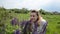 Young charming girl with wildflowers lupins