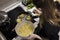 Young charming Swedish woman cooking at home in her kitchen, preparing healthy mediterranean food for her family. Young food