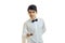 Young charming waiter in a white shirt and black bow tie looks forward and leaning holds in his hand Bell
