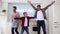 Young cheerful gay family with a kid posing and having fun in a kitchen