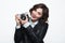 Young cheerful girl with photo camera
