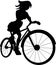 A young cheerful red-haired girl rides a bicycle. The girl smiles. Silhouette. Cartoon.