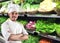 Young chef at supermarket