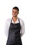 Young chef or waiter wearing black apron isolated