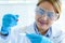 Young chemist scientist female doing experiments chemical working in the laboratory