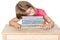 Young Child Falling Asleep on her Books