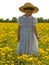 Young child in field of yellow flowers
