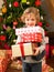 Young child holding gifts