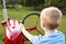 Young Child pretending to drive an old tractor