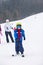 Young child, skiing on snow slope in ski resort in Austria