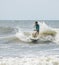 Young child surfing waves on the Atlantic Ocean off South Carolina