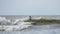 Young child surfing waves on the Atlantic Ocean off South Carolina