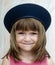 Young child wearing french beret hat