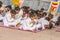 Young children pray in tibetan buddhist monastery Sarnath