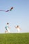 Young children run with kite