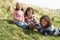 Young Children Sitting Outside In Caravan Park