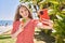 Young chinese girl eating ice cream make selfie by the smartphone at the promenade