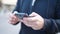 Young chinese man using smartphone at street