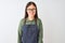 Young chinese shopkeeper woman wearing apron and glasses over isolated white background with a happy and cool smile on face