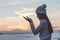 Young christian woman hands open palm up worship and praying to god at sunrise, Christian Religion concept background