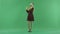 A young Christmas woman is calling by phone on the green screen