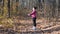 Young chubby woman with nordic walking poles stretching before intensive cardio training. Wellness concept