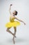 Young classical dancer on white background.