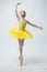 Young classical dancer on white background.