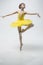 Young classical dancer on white background.