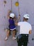 Young climber and father helping