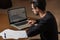 Young computer science student use a laptop to study in Caceres, Spain.