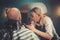 Young Concentrated Blond Woman Does Beard Cut to a Bald Client.