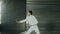 Young concentrated fencer man practice fencing exercises and training for Olympic games competition in studio indoors