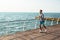 Young concentrated man jogging outdoors