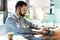 Young concentrated man sitting and working with laptop.