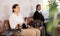 Young confident woman is sitting in the lobby of a large company, waiting for her turn to see a specialist in office