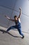 Young contemporary dancer man on grey background
