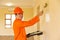 Young contractor painting