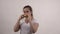 Young cool girl in white t-shirt eating hamburger