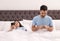 Young couple addicted to smartphones in bed