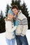 Young Couple In Alpine Snow Scene