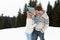 Young Couple In Alpine Snow Scene