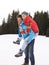 Young Couple In Alpine Snow Scene