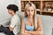 Young couple angry sitting on the sofa in silence at home