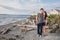 Young Couple on Beach with Ferry and Lighthouse