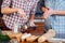 Young couple beating eggs and cooking omelette on the kitchen