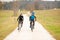 Young couple biking on an autumn afternoon in nature